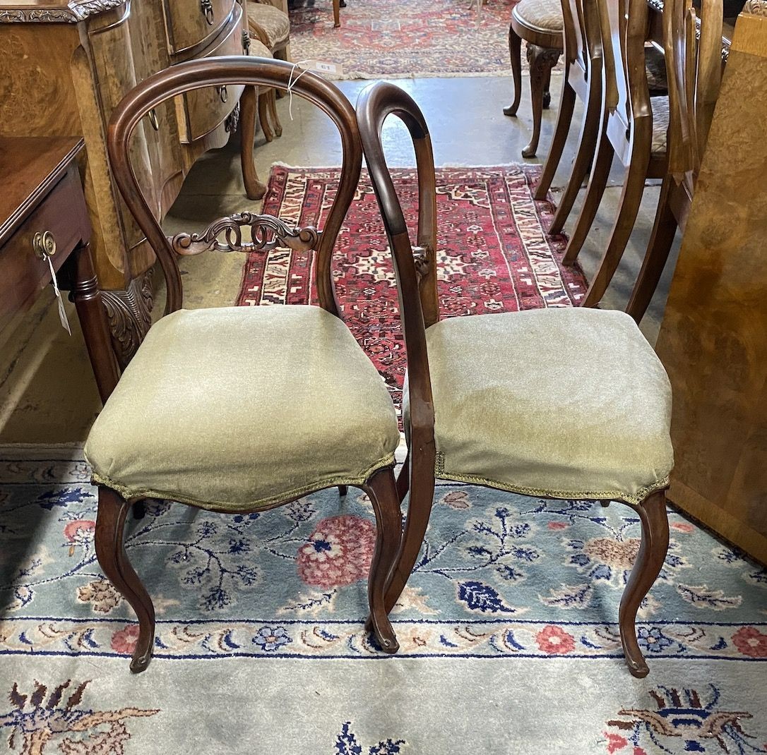 A set of six Victorian rosewood balloon back dining chairs